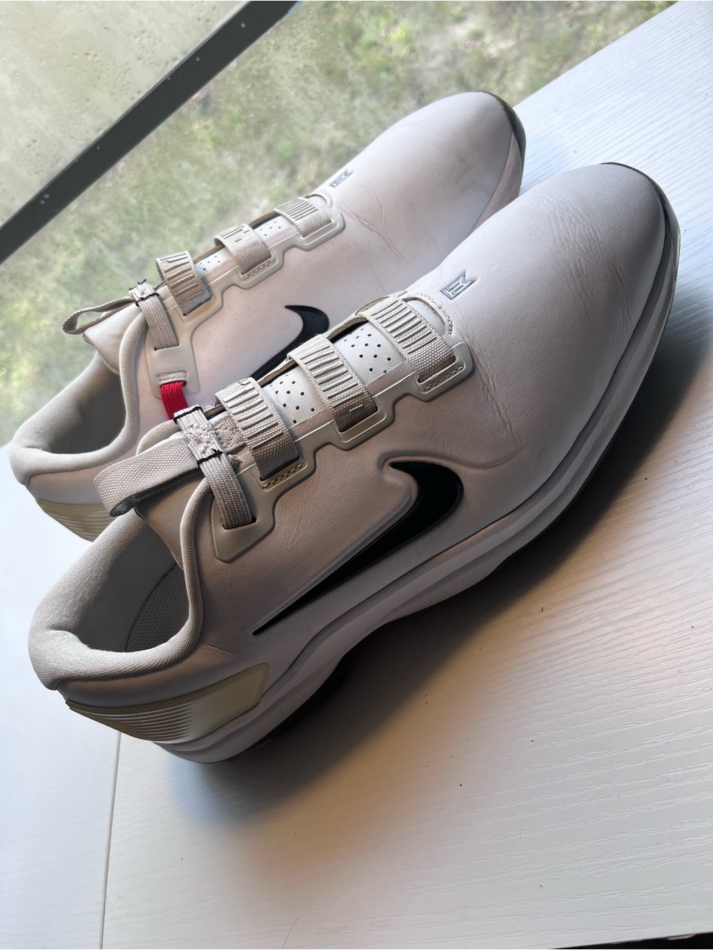 Nike White Sneakers with Black Swoosh and Red Accent